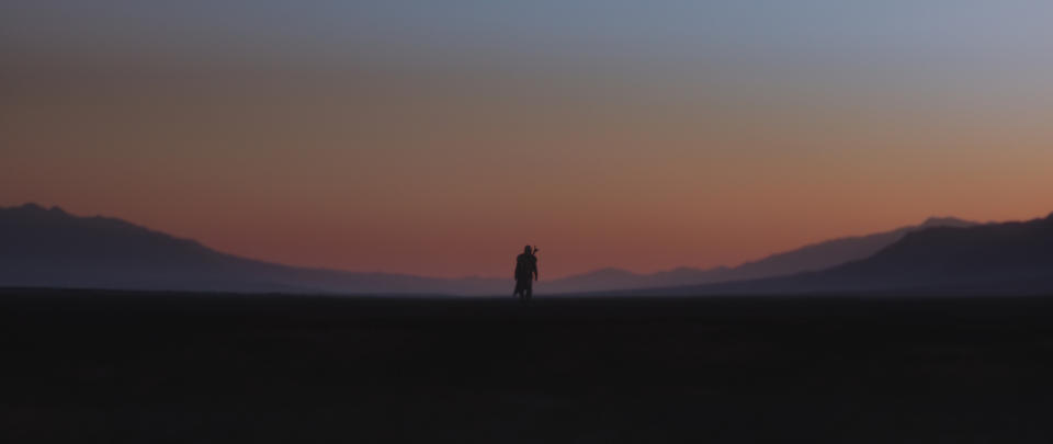 The Mandolorian (Pedro Pascal) walks a lonely road in 'The Child' (Photo: Lucasfilm Ltd.)