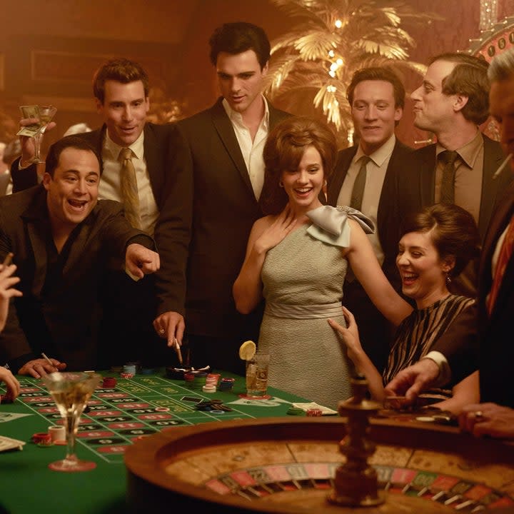 jacob as elvis with a crowd gambling in a casino