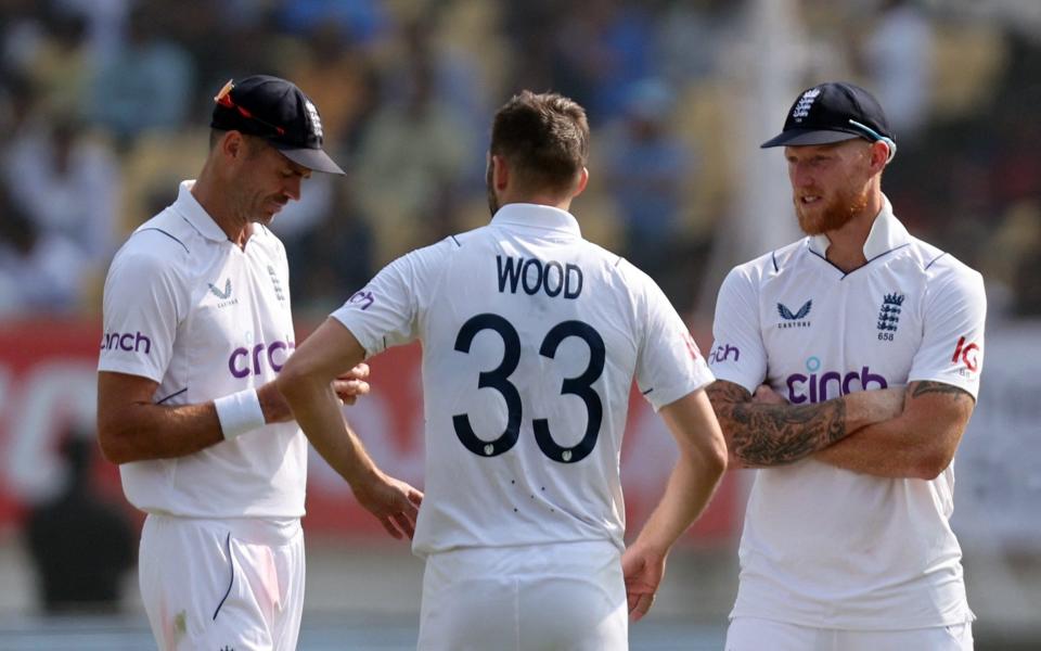 England's Mark Wood with James Anderson and Ben Stokes during the match