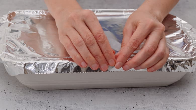 covering baking dish with foil