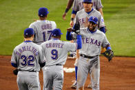 ST LOUIS, MO - OCTOBER 20: Endy Chavez #9 and Elvis Andrus #1 of the Texas Rangers celebrate after defeating the St. Louis Cardinals 2-1 during Game Two of the MLB World Series at Busch Stadium on October 20, 2011 in St Louis, Missouri. (Photo by Dilip Vishwanat/Getty Images)