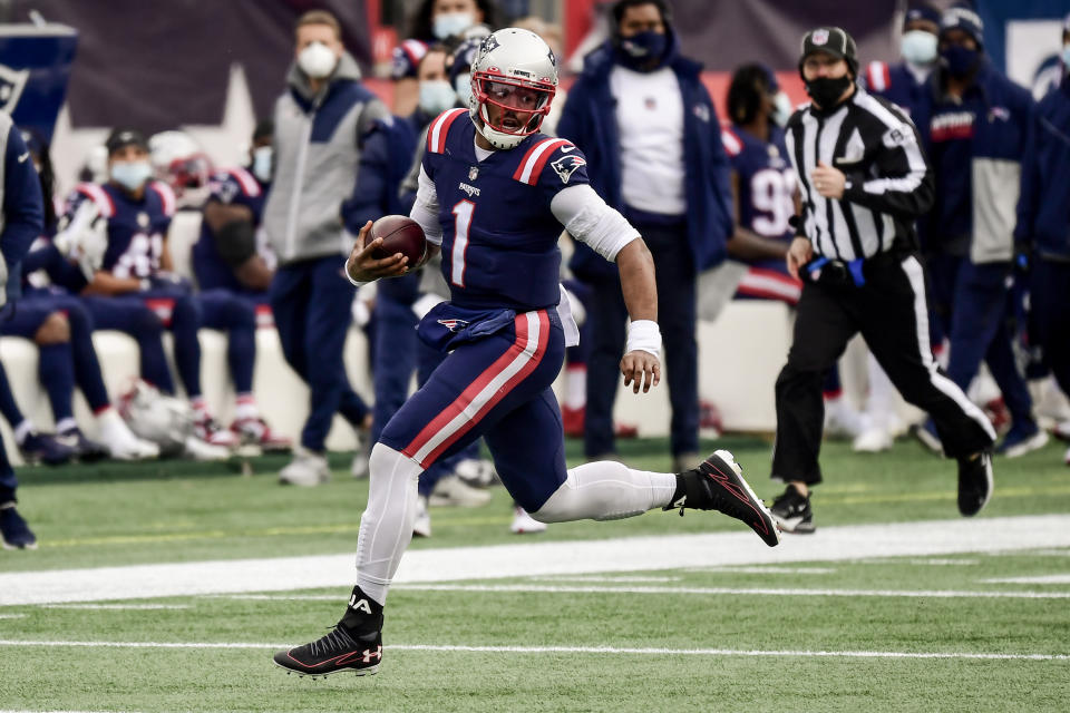 FOXBOROUGH, MA - JANUARY 03: Cam Newton #1 of the New England Patriots carries the ball during the first quarter of a game against the New York Jets at Gillette Stadium on January 3, 2021 in Foxborough, Massachusetts. (Photo by Billie Weiss/Getty Images)