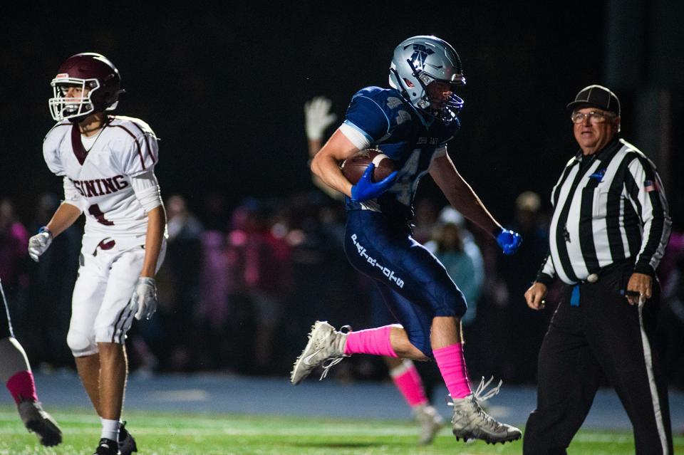 John Jay-East Fishkill's Noah Croutch leaps into the end zone during the Section 1 football game at John Jay-East Fishkill in Wiccopee, NY on Friday, October 21, 2022. John Jay East Fishkill defeated Ossining. KELLY MARSH/FOR THE POUGHKEEPSIE JOURNAL