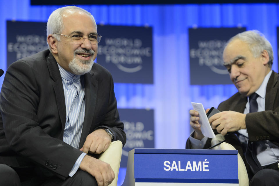 Mohammad Javad Zarif, left, Minister of Foreign Affairs of the Islamic Republic of Iran, and Ghassan Salame, right, Dean of The Paris School of International Affairs, Institut d'Etudes Politiques, attend a panel session on the third day of the 44. Annual Meeting of the World Economic Forum, WEF, in Davos, Switzerland, Friday, Jan. 24, 2014. (AP Photo/Keystone,Laurent Gillieron)