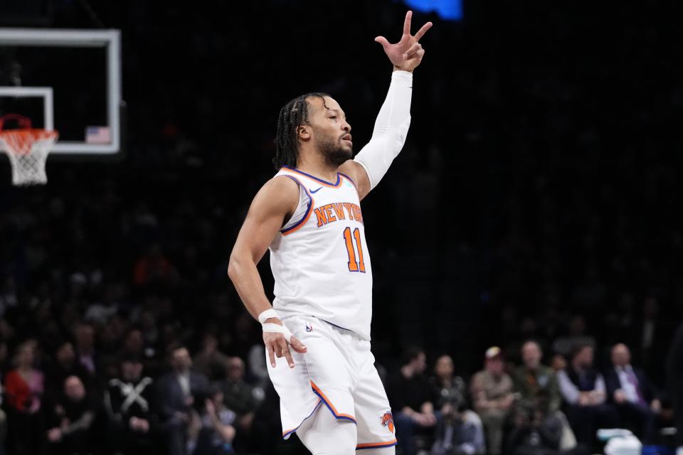 New York Knicks' Jalen Brunson (11) gestures after making a three-point shot during the first half of an NBA basketball game against the Brooklyn Nets Wednesday, Dec. 20, 2023, in New York. (AP Photo/Frank Franklin II)