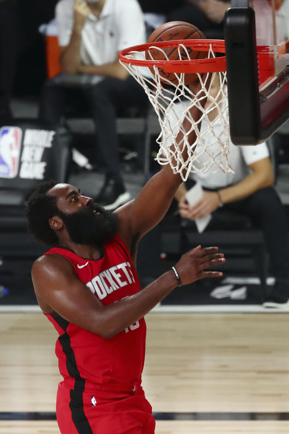 Houston Rockets guard James Harden (13) shoots a layup against the Philadelphia 76ers during the second half of an NBA basketball game Friday, Aug. 14, 2020, in Lake Buena Vista, Fla. (Kim Klement/Pool Photo via AP)