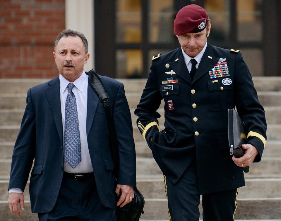 FILE - In this March 4, 2014, file photo, Brig. Gen. Jeffrey Sinclair, right, leaves the courthouse with his lawyers Richard Scheff, left, and Ellen C. Brotman, not pictured, following a day of motions at Fort Bragg, N.C. A news release Sunday, March 16, 2014, from lawyers representing Sinclair said that he will plead to lesser charges in exchange for having the sexual assault charges dropped along with two others that might have required Sinclair to register as a sex offender. Sinclair was accused of twice forcing a female captain to perform oral sex on him during a three-year extramarital affair. (AP Photo/The Fayetteville Observer, James Robinson, File)