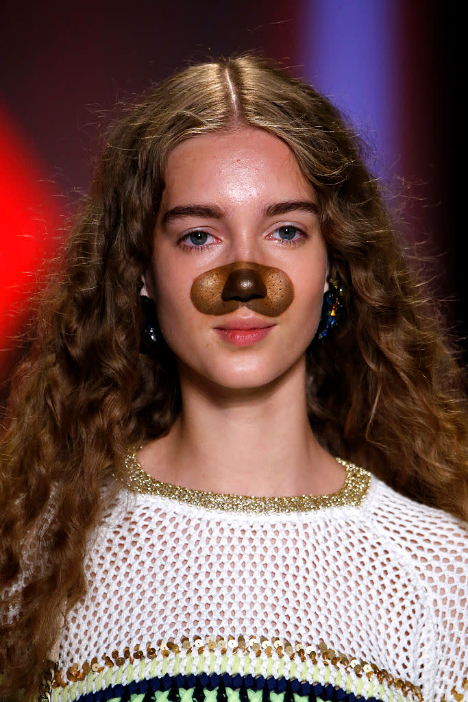 A model sports Snapchat puppy dog filter makeup