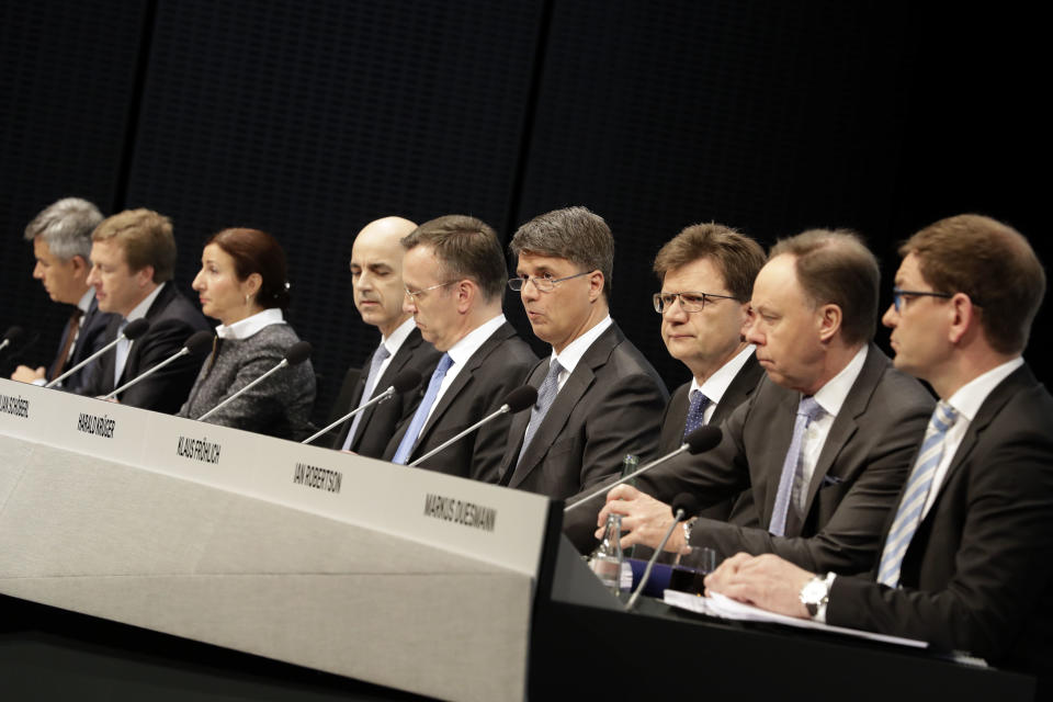 CEO of the German car manufacturer BMW, Harald Krueger, center, briefs the media during the earnings press conference in Munich, Germany, Tuesday, March 21, 2017. (AP Photo/Matthias Schrader)