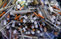 <p>Hypodermic needles that were recovered from the Merrimack River in 2016, at the Clean River Facility facility in Methuen, Mass. Syringes left by drug users amid the heroin crisis are turning up everywhere. They hide in weeds along hiking trails and in playground grass, get washed into rivers and onto beaches, and lie scattered about in baseball dugouts and on sidewalks and streets. There are reports of children finding them and getting poked. (Photo: Charles Krupa/AP) </p>