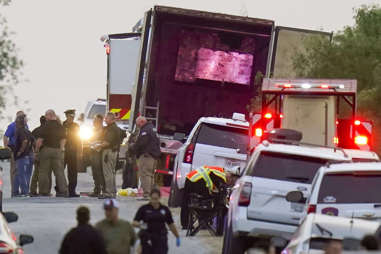 Police and other first responders work the scene where officials say dozens of people have been found dead and multiple others were taken to hospitals with heat-related illnesses after a semitrailer containing suspected migrants was found on Monday, June 27, 2022, in San Antonio.