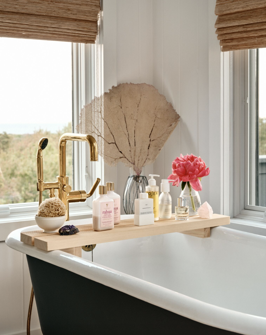 bathroom shelf ideas, bath tray with products on top over the bathtub