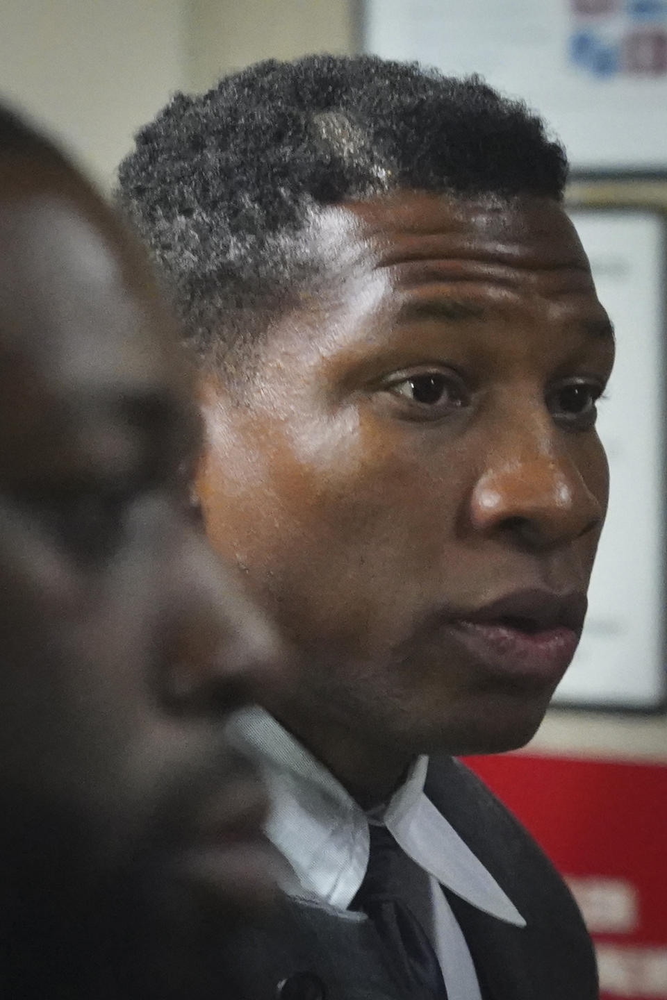 Jonathan Majors, left, returns to court after a lunch break in his domestic assault trial, Tuesday, Dec. 5, 2023, in New York. (AP Photo/Bebeto Matthews)