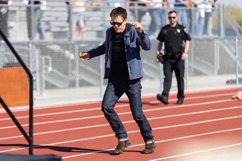 Kevin Bacon dances his way to the stage at Payson High School before partaking in a community kit-building program with Bacon’s charity Six Degrees in Payson on Saturday April 20, 2024. | Marielle Scott, Deseret News