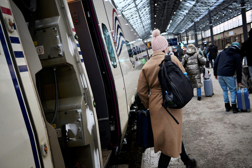 People get off the Allegro train from from St. Petersburg at the central railway station in Helsinki on March 9.<span class="copyright">Antti Aimo-Koivisto—Shutterstock</span>