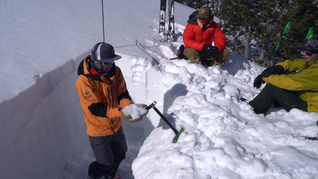 A lesson in snowpack physics by guide Chris Marshall. / Credit: CBS News