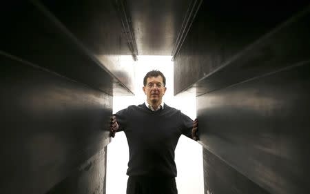 Artist Antony Gormley stands at the entrance to one of his works called "Passage", forming part of an exhibition entitled "Fit", at the White Cube gallery in London, Britain September 29, 2016. REUTERS/Peter Nicholls