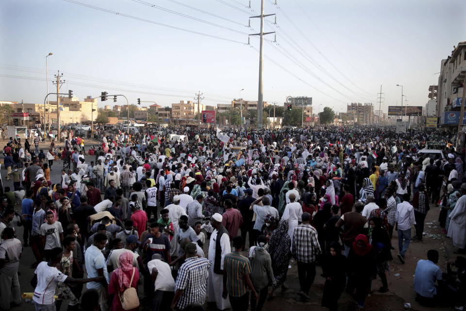 People gather during a protest in Khartoum, Sudan, Saturday, Oct. 30, 2021. Pro-democracy groups called for mass protest marches across the country Saturday to press demands for re-instating a deposed transitional government and releasing senior political figures from detention. (AP Photo/Marwan Ali)