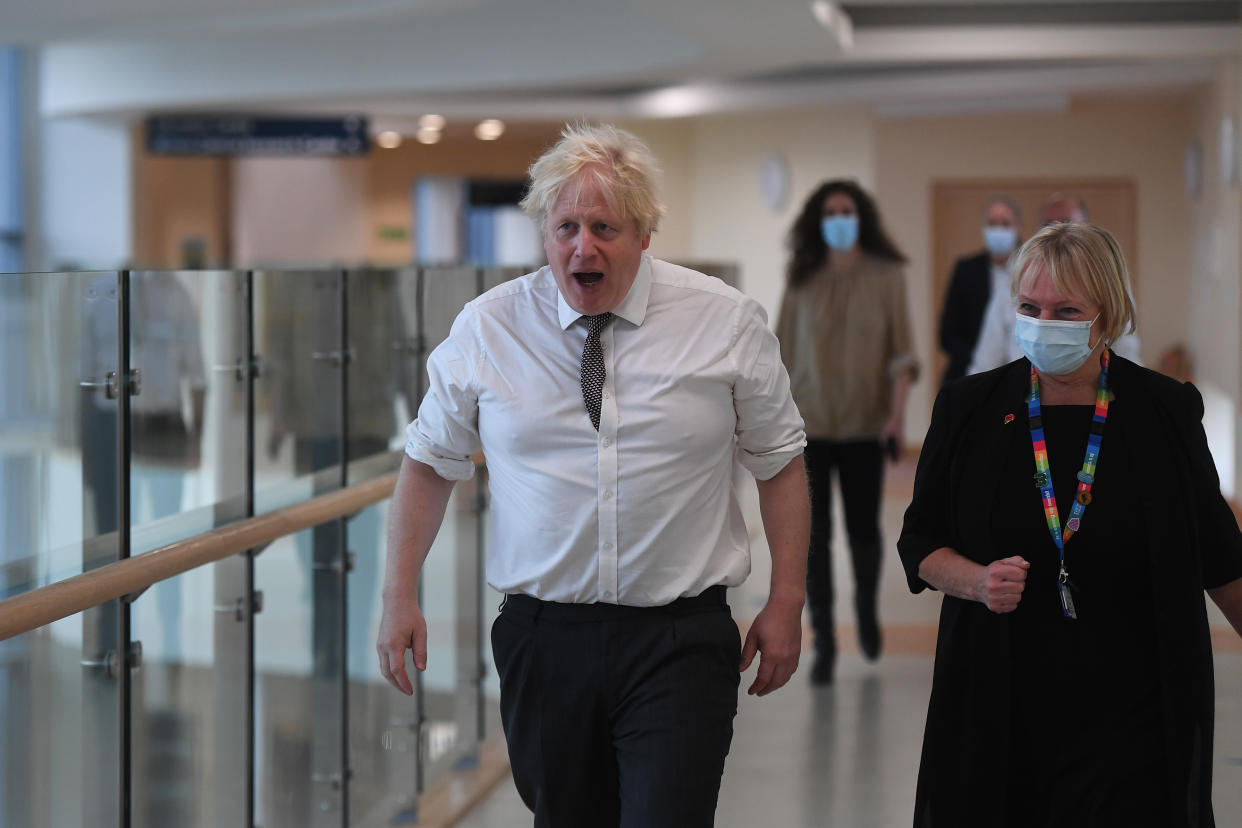 HEXHAM, ENGLAND - NOVEMBER 08: UK prime minister Boris Johnson with Marion Dickson, Executive Director of Nursing, Midwifery and Allied Health Professionals, and Executive Director for Surgery and Community Services for Northumbria Healthcare during a visit to Hexham General Hospital on November 8, 2021 in Hexham, England. (Photo by Peter Summers - WPA Pool/Getty Images)