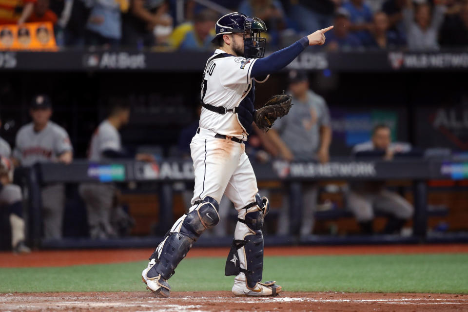 ST. PETERSBURG, FL - OCTOBER 08: Travis d'Arnaud #37 of the Tampa Bay Rays reacts after tagging out Jose Altuve #27 of the Houston Astros at home plate during the fourth inning of Game 4 of the ALDS between the Houston Astros and the Tampa Bay Rays at Tropicana Field on Tuesday, October 8, 2019 in St. Petersburg, Florida. (Photo by Mike Carlson/MLB Photos via Getty Images)