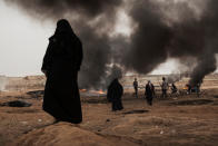 <p>Female Palestinian protesters watch the border fence during clashes with Israeli forces on May 4, 2018 in Khan Yunis, Gaza. Israeli troops fired live rounds and tear gas at Palestinians hurling back stones at the Gaza-Israel border on Friday, injuring about 350 people. (Photo from Etienne De Malglaive/Getty Images) </p>