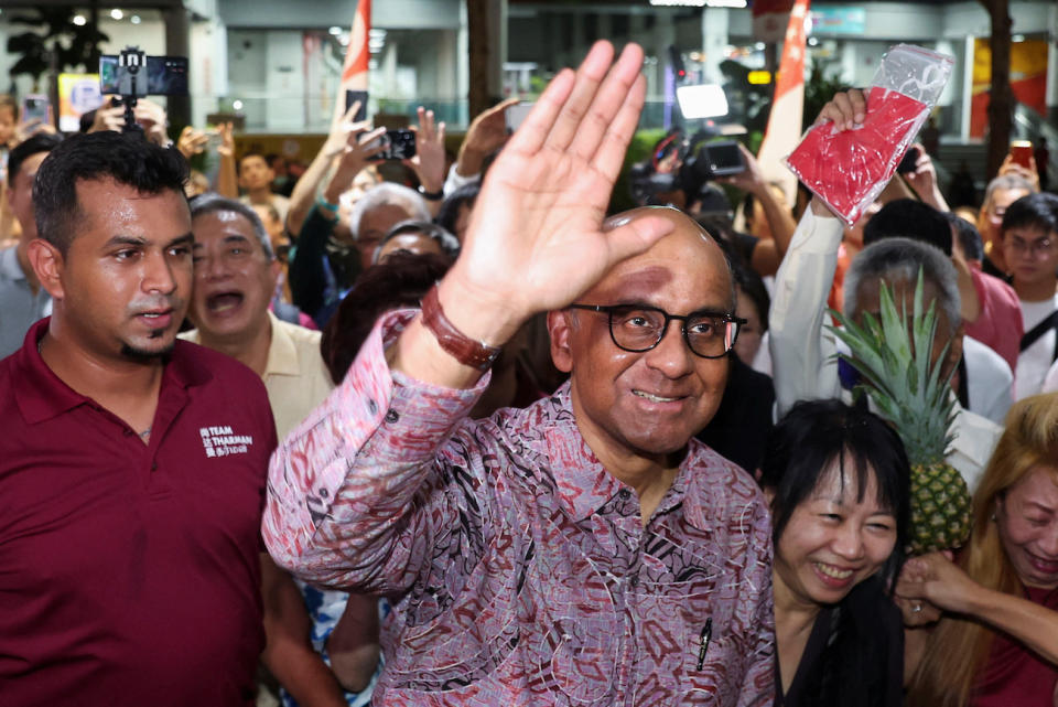 Tharman Shanmugaratnam gestures to supporters after polling has concluded during the presidential election in Singapore.