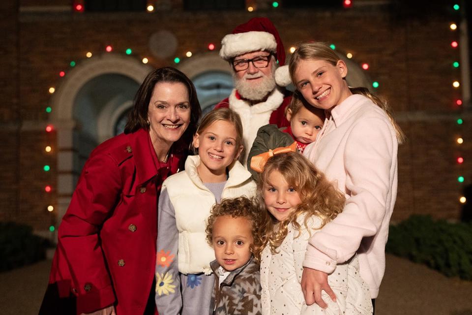 The great-great-grandchildren of Lillian and L.T. Burns are pictured with MSU Texas President Stacia "Stacy" Haynie and Santa -- also known as retired Wichita County Judge Woody Gossom -- at the MSU-Burns Fantasy of Light opening ceremony Nov. 20, 2023. They are Betsy Beakley, 12; Lillian Beakley, 10; Abigail Beakley, 7; Declan O’Conner, 7; River Johnson, 4; and Reese Johnson, 2.