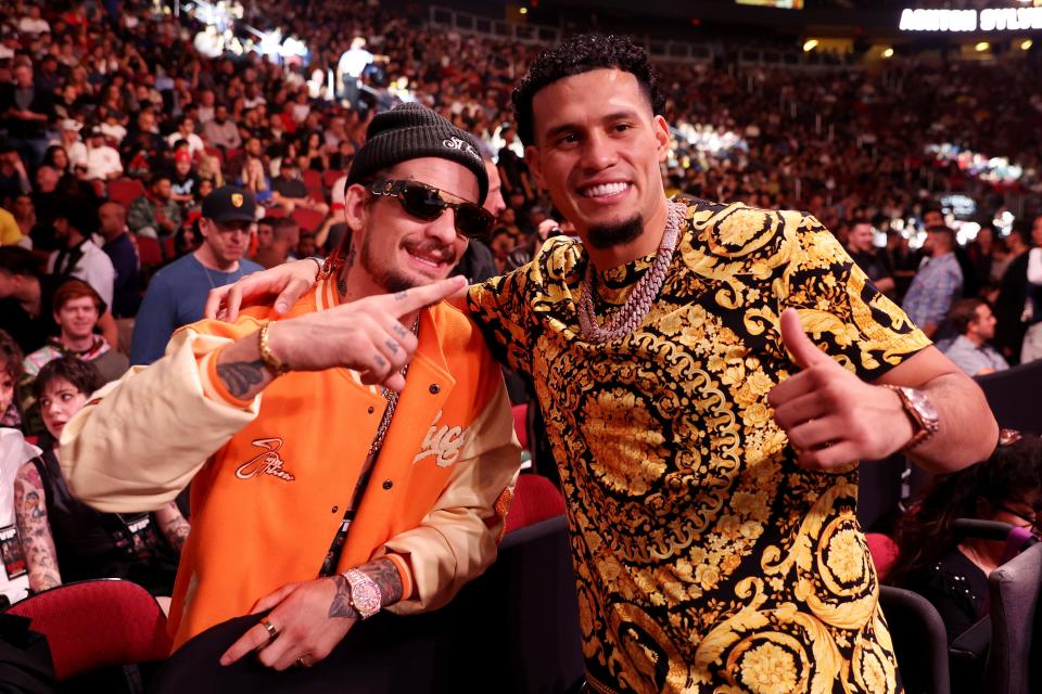 GLENDALE, ARIZONA - OCTOBER 29: UFC fighter Sean O'Malley (L) and boxer David Benavidez attend the fight between Jake Paul and Anderson Silva at Desert Diamond Arena on October 29, 2022 in Glendale, Arizona. (Photo by Christian Petersen/Getty Images)