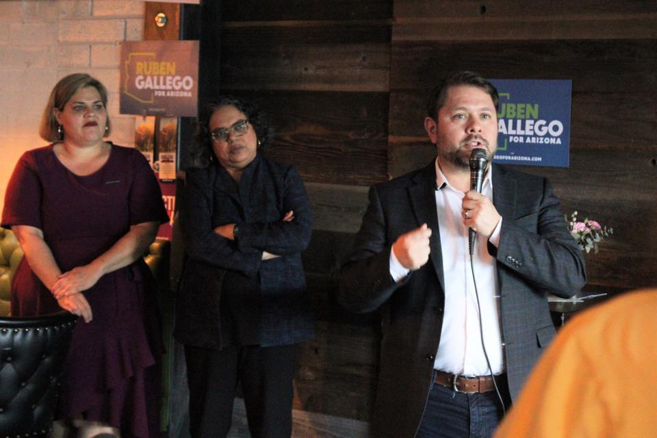 Rep. Ruben Gallego, D-Ariz., speaks at his campaign event with Reproductive Freedom for All at The Other Bar in Phoenix on Wednesday, Feb. 21. Mini Timmaraju and Raquel Terán look on.
