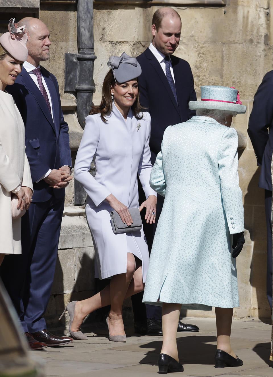 Britain's Kate, The Duchess of Cambridge curtsies as Britain's Queen Elizabeth II arrives to attend the Easter Mattins Service at St. George's Chapel, at Windsor Castle in England Sunday, April 21, 2019. (AP Photo/Kirsty Wigglesworth, pool)