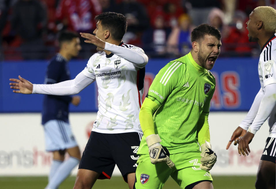 Dallas goalkeeper Maarten Paes (30) reacts after stopping a penalty shot by Sporting Kansas City in the second half of an MLS soccer match, Saturday, March 18, 2023, in Frisco, Texas. (AP Photo/Richard W. Rodriguez)