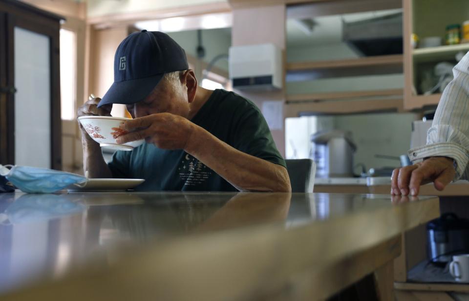 Hideo Suetake drinks soup