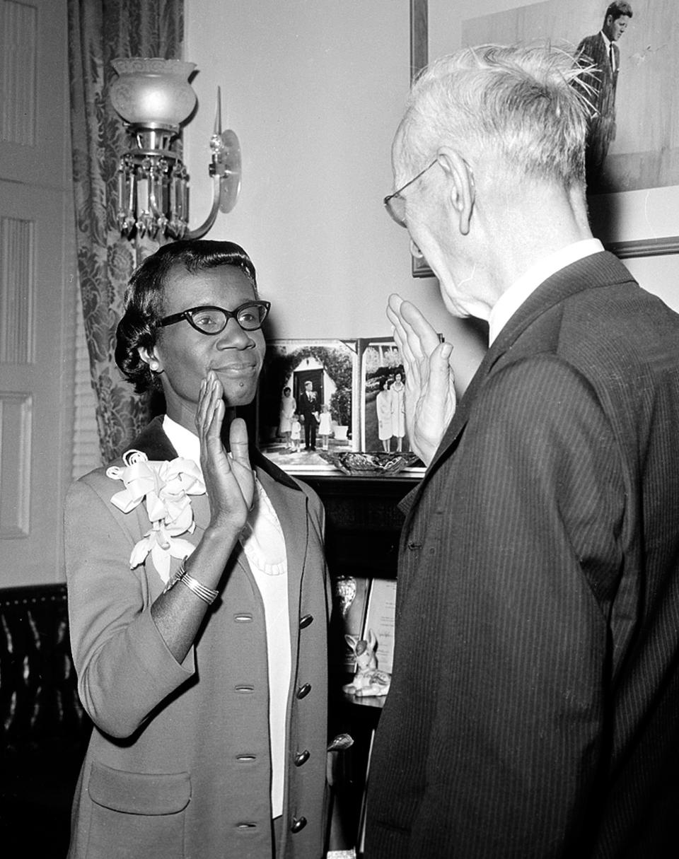 FILE - In this Jan. 3, 1969 file photo, Democrat congresswoman Shirley Chisholm, of New York, takes her oath of office in Washington, D.C. The pioneering lawmaker will be honored with a statue in the New York City borough she served as the first black woman elected to the U.S. Congress. New York City officials announced Friday, Nov. 30, 2018, that a monument to Chisholm will be installed at the entrance to Brooklyn's Prospect Park. (AP Photo/File)