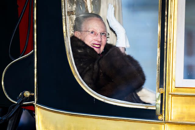 <p>Martin Sylvest Andersen/Getty</p> Queen Margrethe travels in the gold coach to Christiansborg Palace in Copenhagen on Jan. 4.