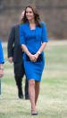 <p>Kate visited the Tower of London in a bright blue dress by L.K. Bennett and navy suede Jimmy Choos. The Duchess accessorised with a Stuart Weitzman clutch.</p><p><i>[Photo: PA]</i></p>