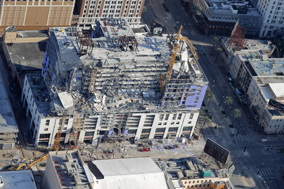 FILE - Two large cranes from the Hard Rock Hotel construction collapse are seen in this aerial photo after crashing down, after being detonated for implosion in New Orleans, Sunday, Oct. 20, 2019. A grand jury in Louisiana on Thursday, Oct. 5, 2023, has decided against indicting anyone in the deadly collapse hotel that had been under construction in New Orleans. (AP Photo/Gerald Herbert, File)