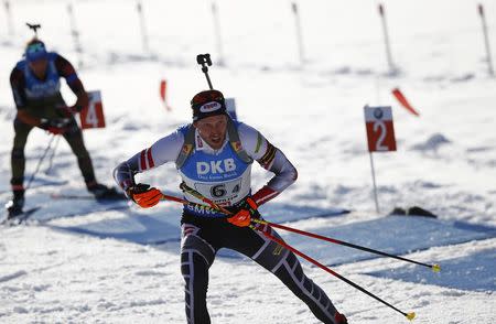 Biathlon - IBU World Championships - Men 4 x 7.5 km Relay - Hochfilzen, Austria - 18/2/17 - Dominik Landertinger of Austria leaves the shooting range. REUTERS/Leonhard Foeger