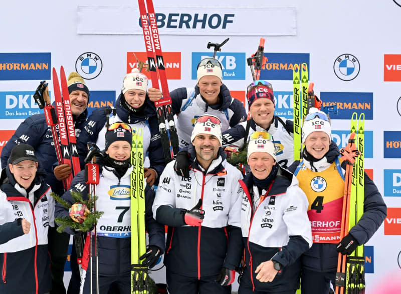 Norway's Biathlon team stand together for a group photo after wining the men's relay 4 x 7.5 km of the Biathlon World Cup in the Lotto Thuringia Arena at Rennsteig. Martin Schutt/dpa