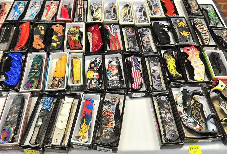 Vietnam veteran Larry Salyers was a first-time vendor selling a variety of knives at this year's Hillsdale Arts and Crafts Festival at Hillsdale High School on Saturday.