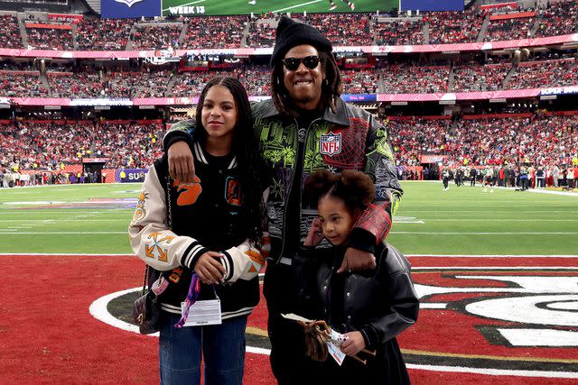 <p>Kevin Mazur/Getty</p> JAY-Z with Blue Ivy (left) and Rumi (right)