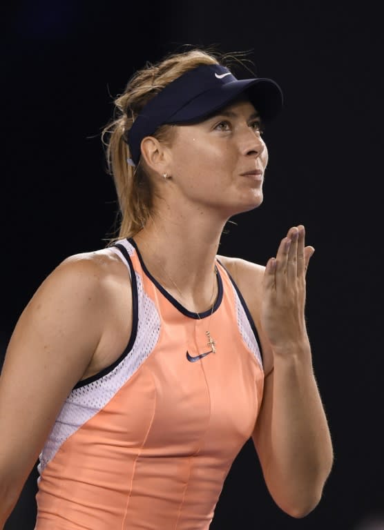 Russia's Maria Sharapova celebrates victory against Lauren Davis of the United States at the Australian Open on January 22, 2016