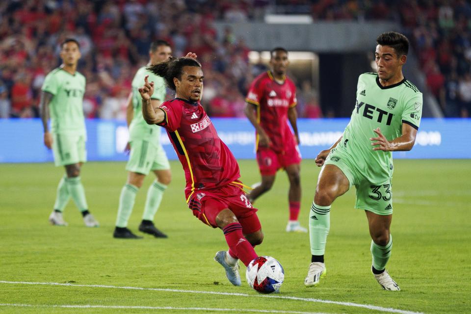 St. Louis City SC midfielder Aziel Jackson, left, and Austin FC midfielder Owen Wolff (33) chase after the ball during an MLS soccer match in St. Louis, Sunday, Aug. 20, 2023. (Michael Clubb/St. Louis Post-Dispatch via AP)