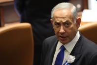 Israel's Likud Party leader Benjamin Netanyahu arrives during the swearing-in ceremony for Israeli lawmakers at the Knesset, Israel's parliament, in Jerusalem, Tuesday, Nov. 15, 2022. Israeli lawmakers were sworn in at the Knesset, on Tuesday, following national elections earlier this month. (Abir Sultan/Pool Photo via AP)