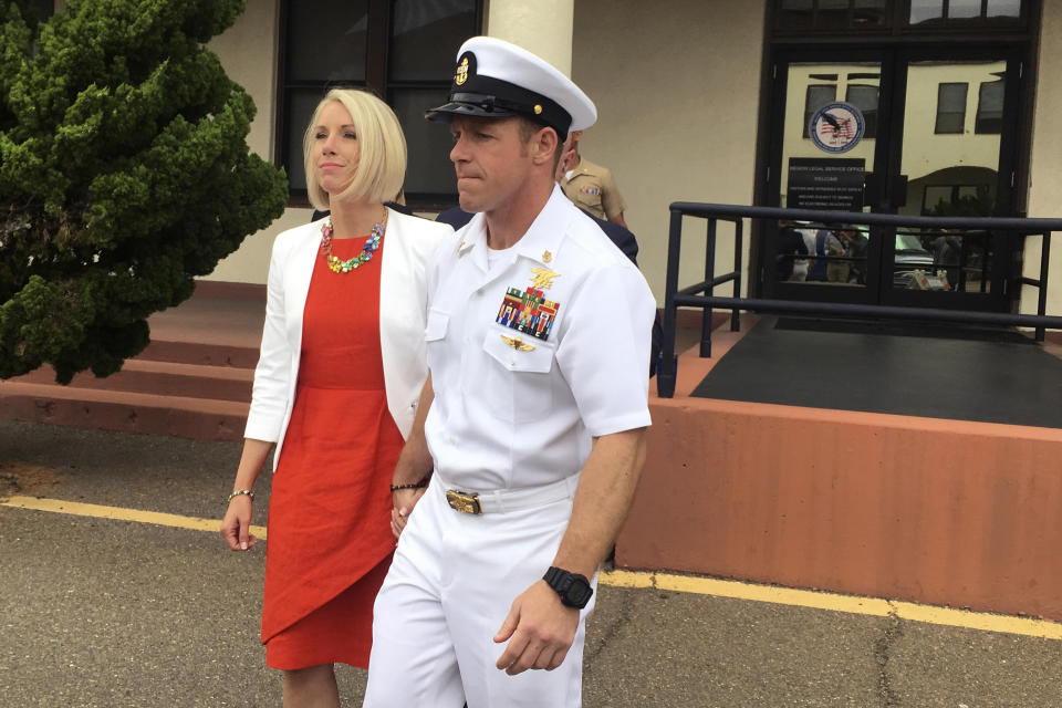 FILE - In this Thursday, May 30, 2019, file photo, Navy Special Operations Chief Edward Gallagher leaves a military courtroom on Naval Base San Diego with his wife, Andrea Gallagher, in San Diego. Edward Gallagher, who has been charged with allegedly killing an Islamic State prisoner in his care and attempted murder for the shootings of two Iraq civilians in 2017, is scheduled to go on trial Monday, June 17, 2019. (AP Photo/Julie Watson, File)