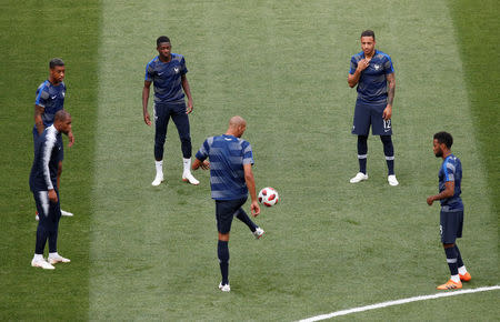 Soccer Football - World Cup - Final - France v Croatia - Luzhniki Stadium, Moscow, Russia - July 15, 2018 France's Steven Nzonzi, Ousmane Dembele, Corentin Tolisso and team mates during the warm up before the match REUTERS/Christian Hartmann