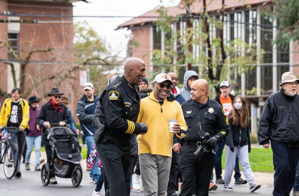 Sacramento County Sheriff Jim Cooper talks with other marchers during the MLK365 March for the Dream honoring Martin Luther King Jr. on Monday, Jan. 16, 2023, in Sacramento. The main march began and ended at Sacramento City College in a “love loop” that included Land Park Drive, Broadway and Freeport Boulevard. Xavier Mascareñas/xmascarenas@sacbee.com