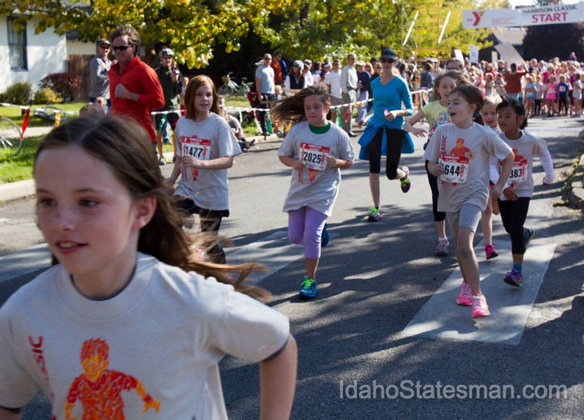 In this 2013 Statesman file photo, kids 10 and older run a mile up Harrison Boulevard in the annual YMCA Harrison Classic.