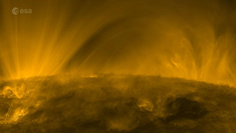 A swirling orange mass rises from the bottom, shooting streams of plasma.