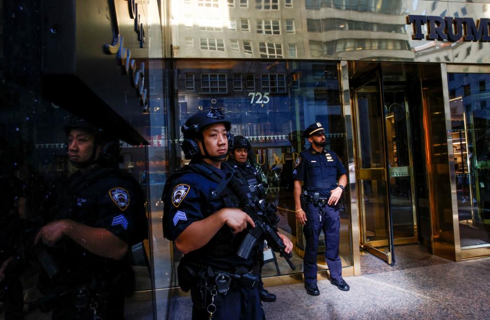 Police officers stand guard at Trump Tower after Republican presidential candidate and former U.S. President Donald Trump was injured when shots were fired during a campaign rally held in Butler, in New York, U.S., July 14, 2024. REUTERS/Eduardo Munoz