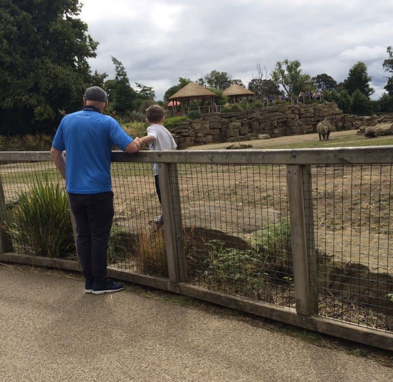 The white rhino is seen staring down the little boy. Photo: Twitter/Adrianna Straszewska